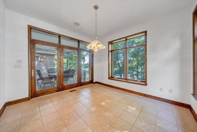 723 Fox Chase Rd, Wirtz, VA 24184 - unfurnished room with baseboards, a chandelier, and tile patterned floors
