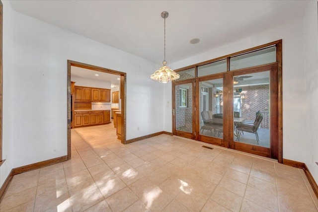 723 Fox Chase Rd, Wirtz, VA 24184 - empty room featuring baseboards and a chandelier