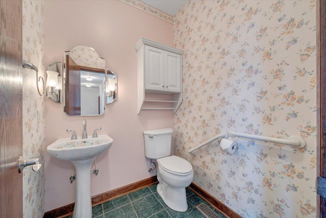 723 Fox Chase Rd, Wirtz, VA 24184 - bathroom featuring toilet, baseboards, tile patterned flooring, and a sink