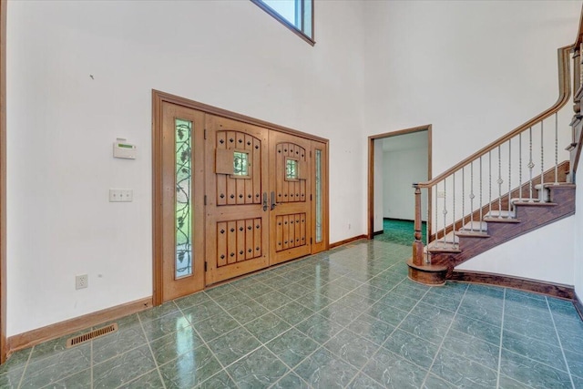 723 Fox Chase Rd, Wirtz, VA 24184 - entryway featuring a towering ceiling, baseboards, and stairway
