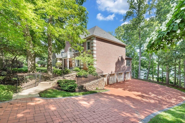 723 Fox Chase Rd, Wirtz, VA 24184 - view of patio / terrace featuring a garage and decorative driveway