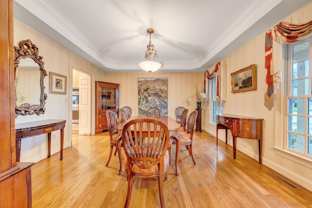 3649 Peakwood Dr SW, Roanoke, VA 24014 - dining room featuring light wood-style floors, ornamental molding, and a tray ceiling