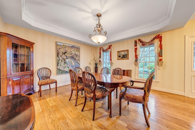 3649 Peakwood Dr SW, Roanoke, VA 24014 - dining room featuring a raised ceiling, crown molding, and light wood-style flooring