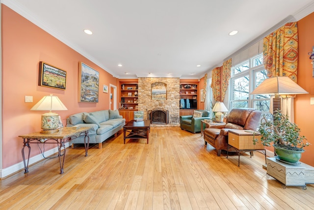 3649 Peakwood Dr SW, Roanoke, VA 24014 - living room featuring light wood finished floors, crown molding, recessed lighting, built in shelves, and a stone fireplace