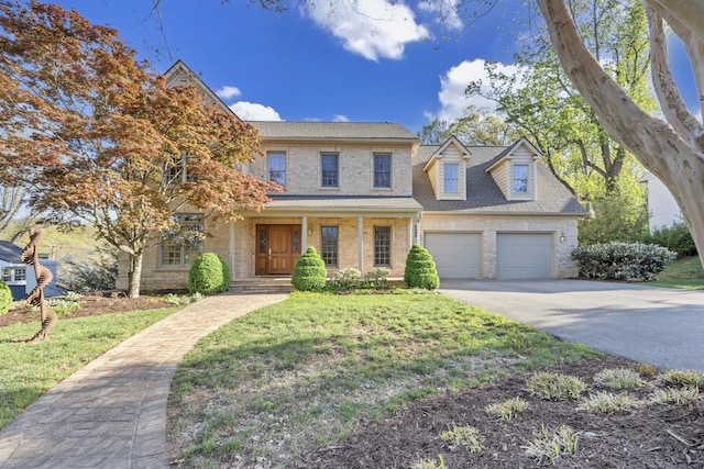 3649 Peakwood Dr SW, Roanoke, VA 24014 - view of front facade with driveway, a porch, a front lawn, and brick siding