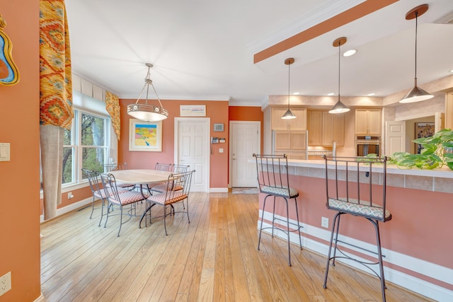3649 Peakwood Dr SW, Roanoke, VA 24014 - dining space featuring light wood-style floors and ornamental molding