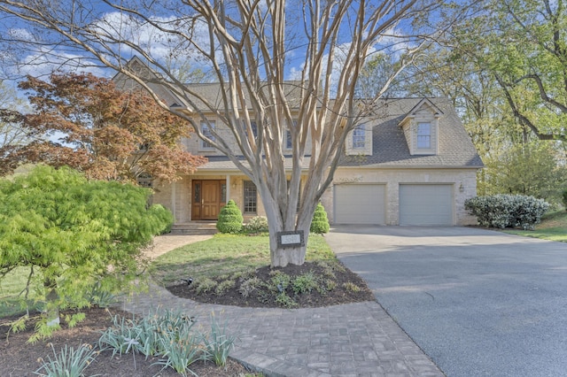 3649 Peakwood Dr SW, Roanoke, VA 24014 - view of property hidden behind natural elements with driveway, a garage, brick siding, and roof with shingles