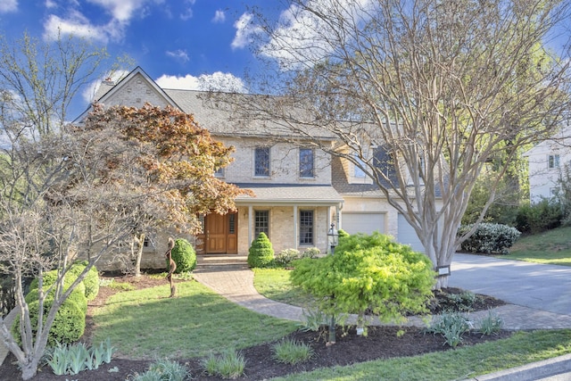 3649 Peakwood Dr SW, Roanoke, VA 24014 - traditional-style house featuring an attached garage, concrete driveway, a front lawn, and a shingled roof