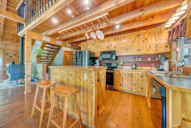 kitchen featuring a sink, beamed ceiling, wood ceiling, black appliances, and light wood-style flooring