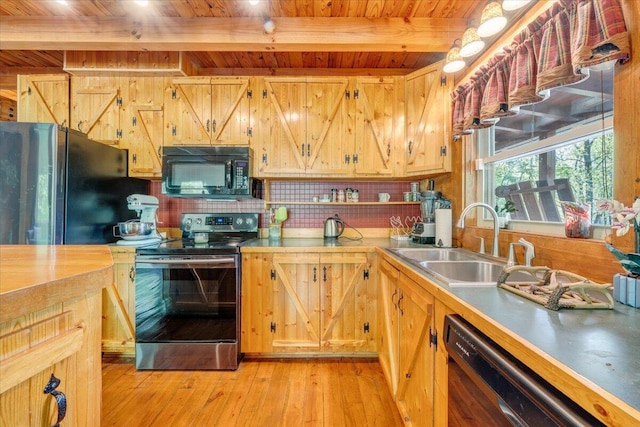 kitchen featuring black appliances, wooden ceiling, a sink, and light wood-style flooring