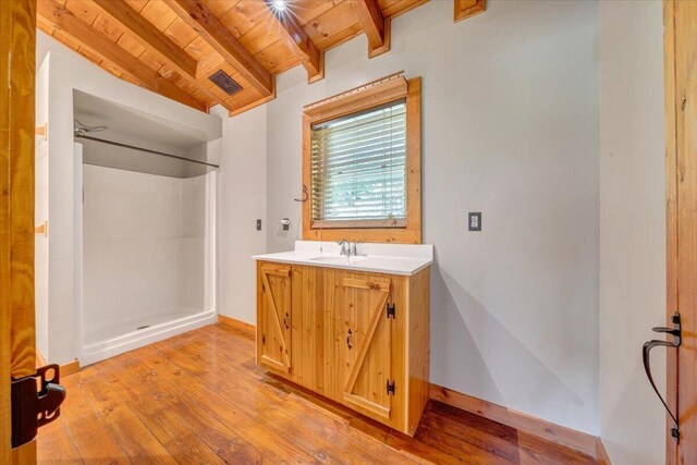 full bath featuring wood ceiling, wood finished floors, beam ceiling, and a shower