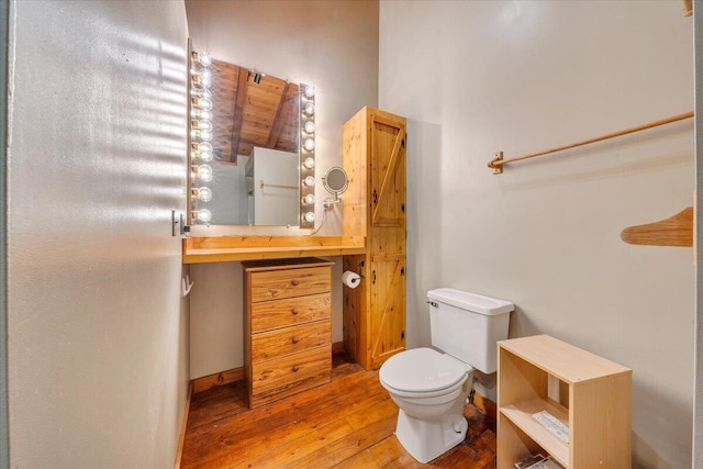 bathroom featuring hardwood / wood-style floors, toilet, and vanity