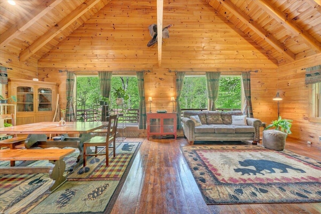 living room with beamed ceiling, high vaulted ceiling, and wood ceiling