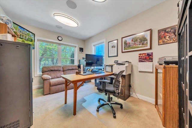 carpeted home office with baseboards