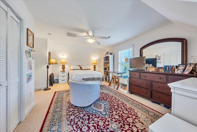bedroom with baseboards, a ceiling fan, visible vents, and carpet
