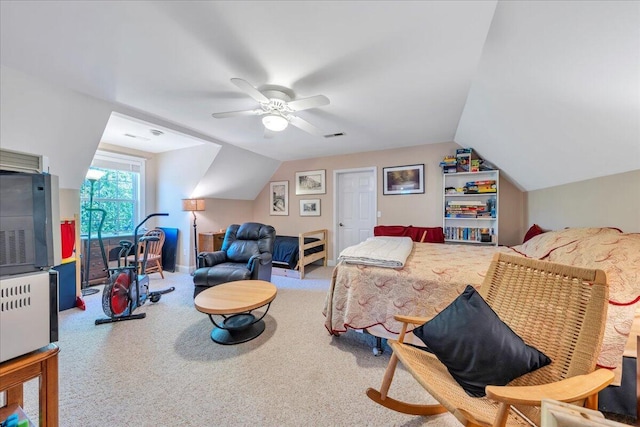 bedroom featuring a ceiling fan, carpet floors, and lofted ceiling