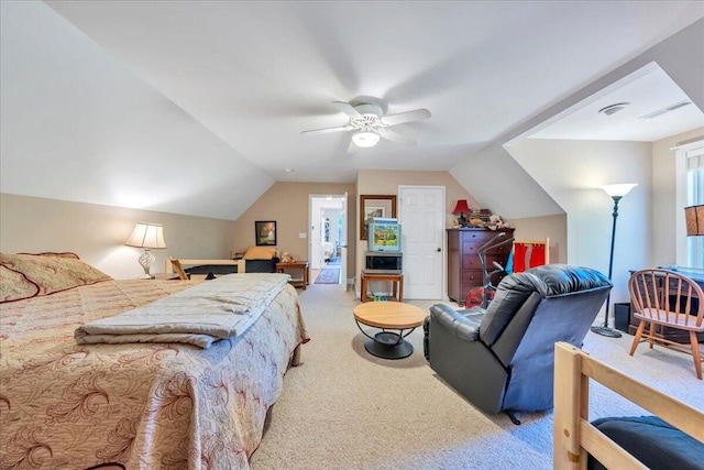 bedroom with vaulted ceiling, carpet, and ceiling fan