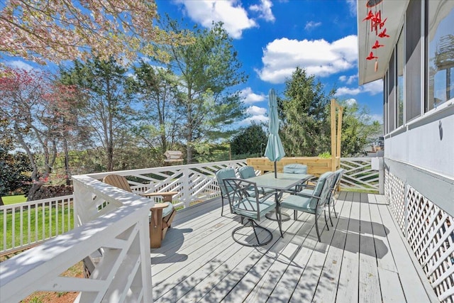 deck with outdoor dining area