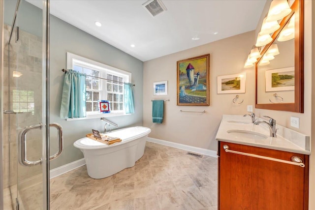 bathroom featuring a sink, double vanity, baseboards, visible vents, and a shower stall