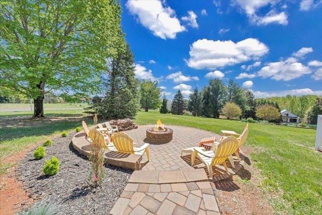view of patio / terrace with an outdoor fire pit