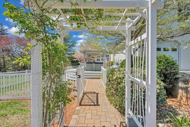 view of patio featuring a pergola and fence