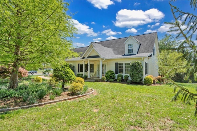 cape cod home with a porch and a front yard