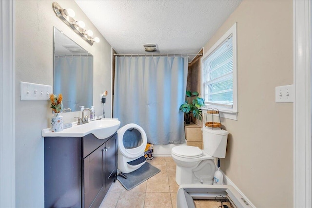 1944 Burma Rd, Salem, VA 24153 - bathroom featuring vanity, tile patterned flooring, a textured ceiling, toilet, and visible vents