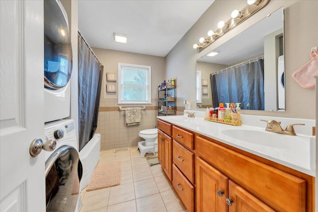 1944 Burma Rd, Salem, VA 24153 - bathroom featuring double vanity, tile patterned floors, stacked washer / drying machine, tile walls, and a sink