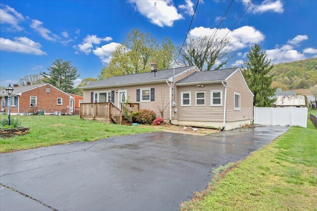 1944 Burma Rd, Salem, VA 24153 - view of front of house with aphalt driveway, fence, and a front lawn