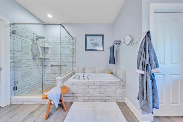 398 River Ridge Rd SE, Copper Hill, VA 24079 - full bathroom with a garden tub, a shower stall, and wood finished floors