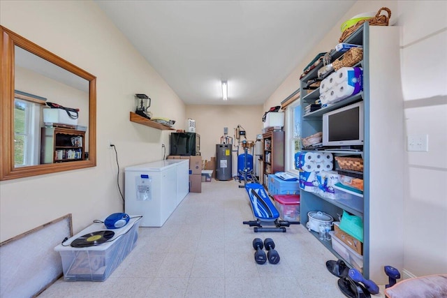 398 River Ridge Rd SE, Copper Hill, VA 24079 - clothes washing area with electric water heater, tile patterned floors, and washer and dryer