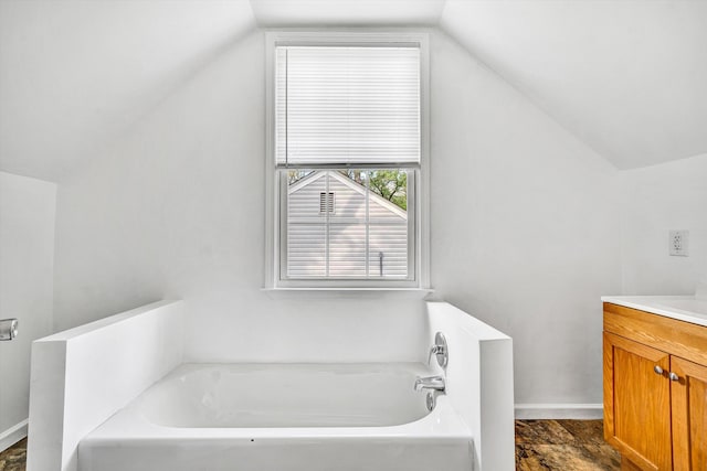 2513 Liberty Rd NW, Roanoke, VA 24012 - full bathroom with vaulted ceiling, vanity, a bath, and baseboards