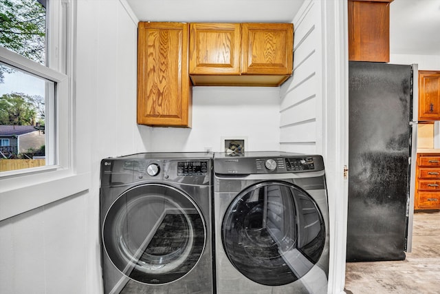 2513 Liberty Rd NW, Roanoke, VA 24012 - washroom featuring washing machine and clothes dryer and cabinet space