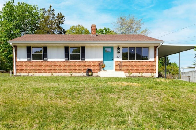 ranch-style house with a front yard, a chimney, and brick siding