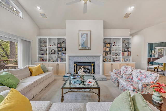 living area featuring a fireplace, ceiling fan, and recessed lighting