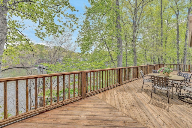 wooden terrace featuring outdoor dining space