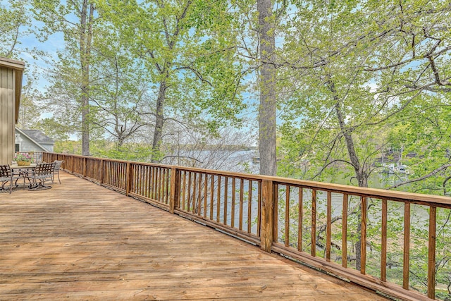 deck with outdoor dining area