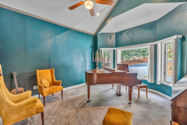 home office with wallpapered walls, a ceiling fan, carpet flooring, and high vaulted ceiling