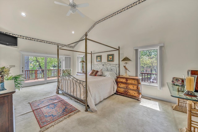 bedroom with multiple windows, access to outside, carpet, and high vaulted ceiling