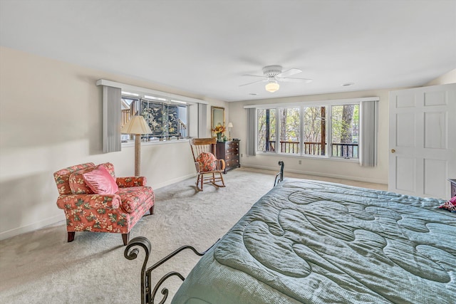bedroom with ceiling fan, carpet floors, and baseboards