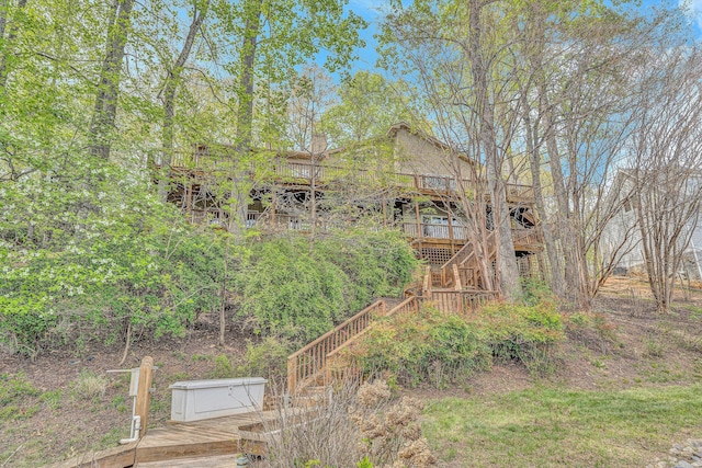 exterior space featuring stairway and a deck