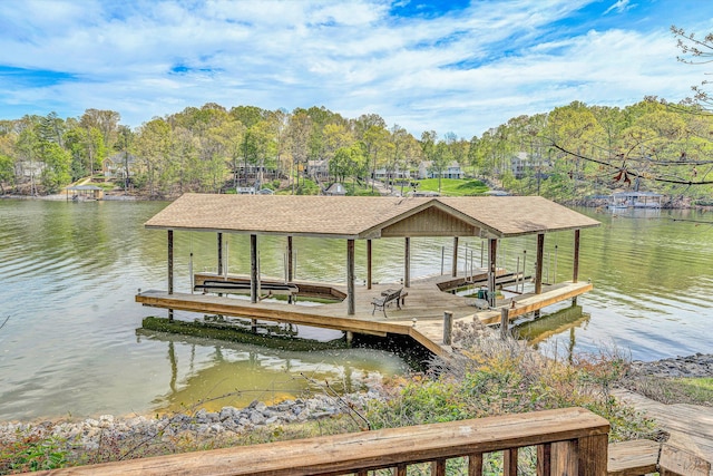 view of dock with boat lift and a water view