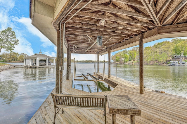 view of dock featuring boat lift and a water view