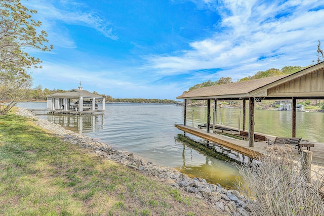 view of dock featuring boat lift and a water view