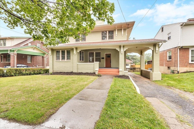 2219 Carter Rd SW, Roanoke, VA 24015 - view of front of house with a porch, a front lawn, and stucco siding