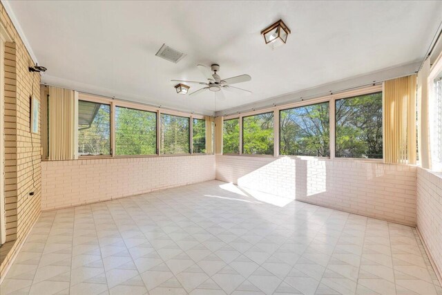 5241 N Spring Dr, Roanoke, VA 24019 - unfurnished sunroom featuring brick wall and a ceiling fan