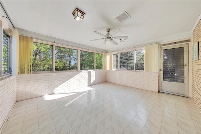 5241 N Spring Dr, Roanoke, VA 24019 - unfurnished sunroom featuring brick wall, a ceiling fan, and tile patterned floors