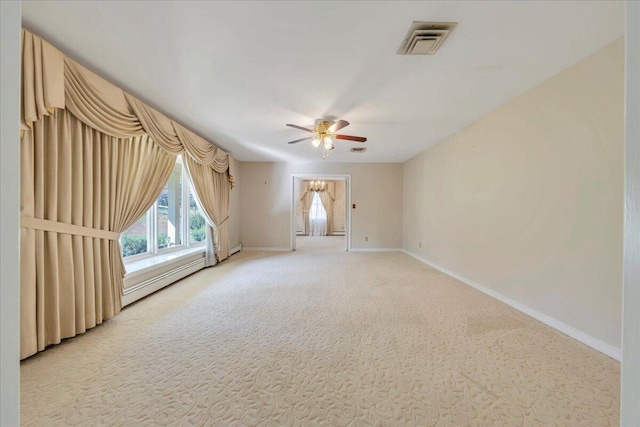 5241 N Spring Dr, Roanoke, VA 24019 - empty room featuring ceiling fan, baseboards, light carpet, and a baseboard radiator