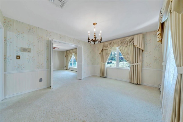 5241 N Spring Dr, Roanoke, VA 24019 - carpeted empty room featuring wallpapered walls, a chandelier, plenty of natural light, and wainscoting