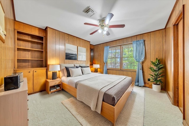 5241 N Spring Dr, Roanoke, VA 24019 - bedroom with light colored carpet, wood walls, and ceiling fan